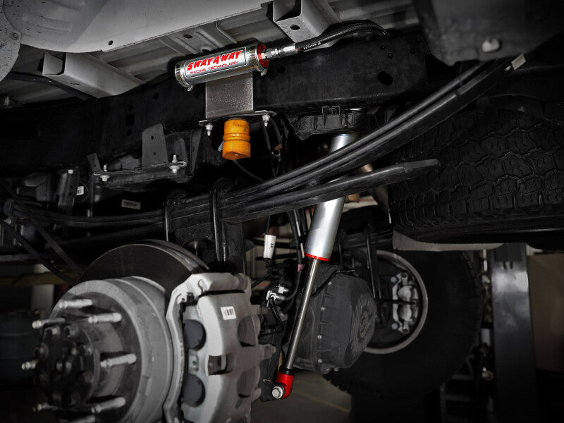 afe Sway-A-Way Smooth Body Shocks installed on a Ford F-250/F-350 4WD, showcasing suspension components and undercarriage details.