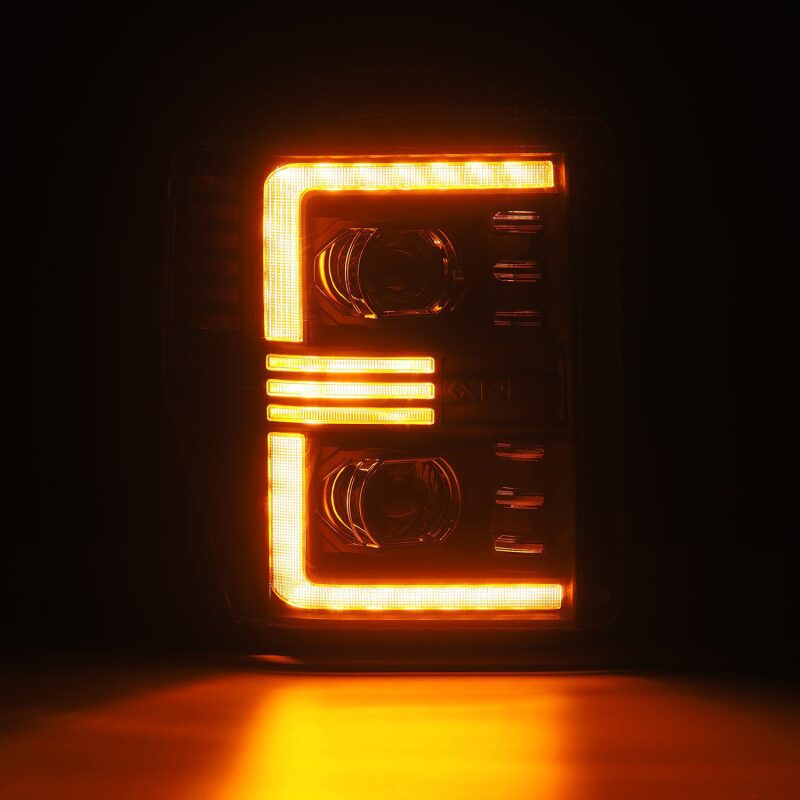 AlphaRex PRO-Series projector headlights for 08-10 Ford F250-550, featuring black housing and sequential signal lights.