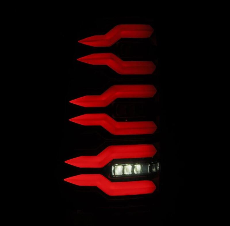 AlphaRex LUXX-Series LED tail lights for 99-06 Chevrolet Silverado and Sierra in Alpha-Black with striking red design.