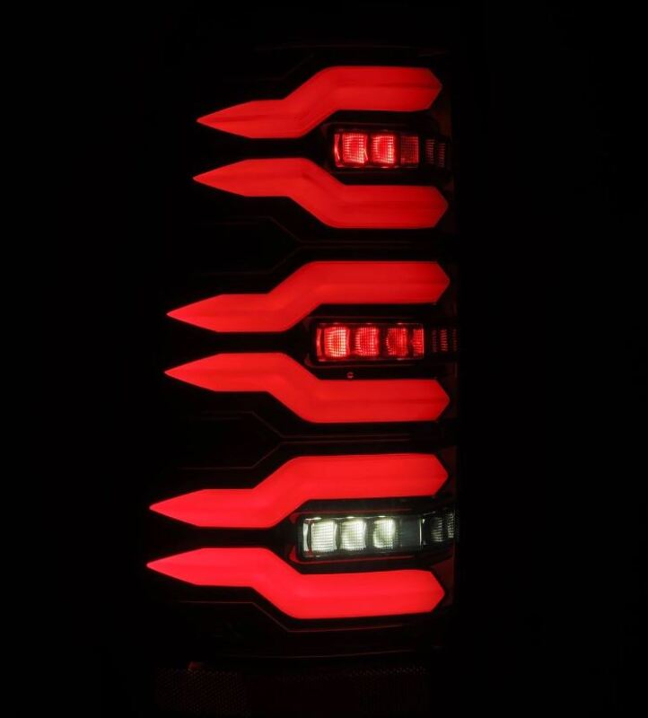AlphaRex LUXX-Series LED tail lights for 99-06 Chevrolet Silverado and GMC Sierra in black with striking red illumination.