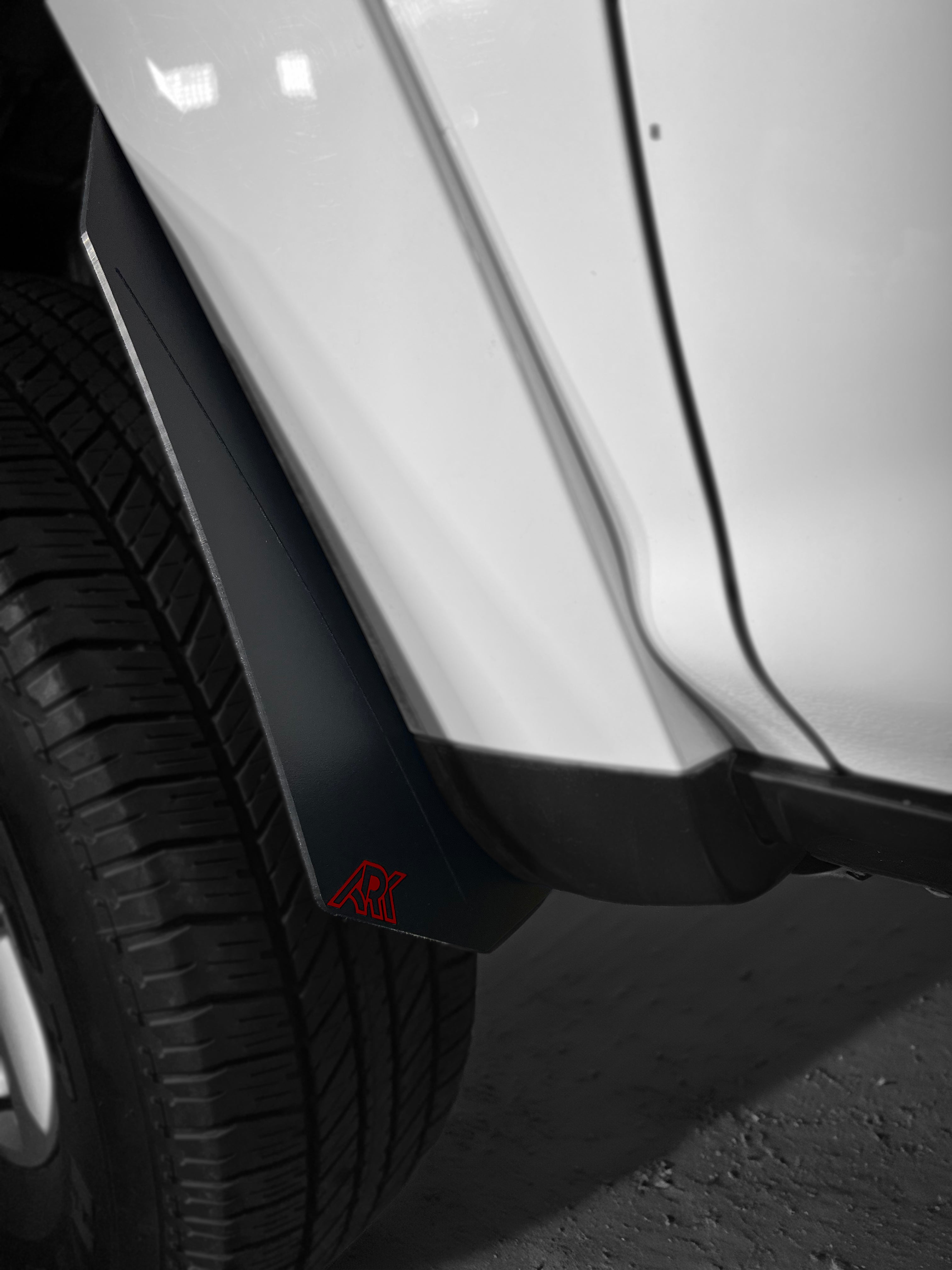 Toyota 4Runner Micro Flare Mud Flap Deletes installed on a vehicle, showcasing sleek design and tire protection.