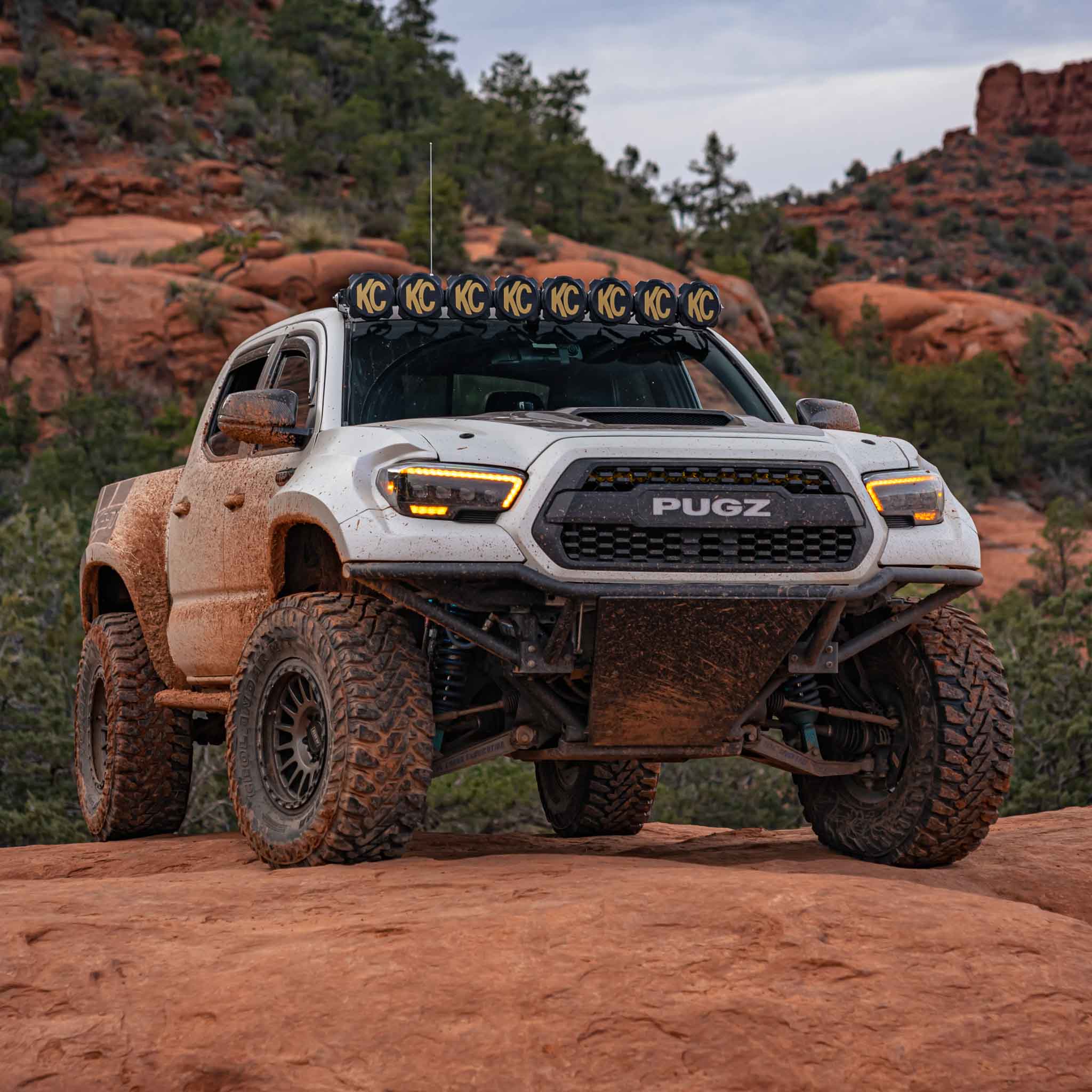 2016-2023 Toyota Tacoma fenders on a lifted truck in a rugged outdoor setting, showcasing offroad capabilities.