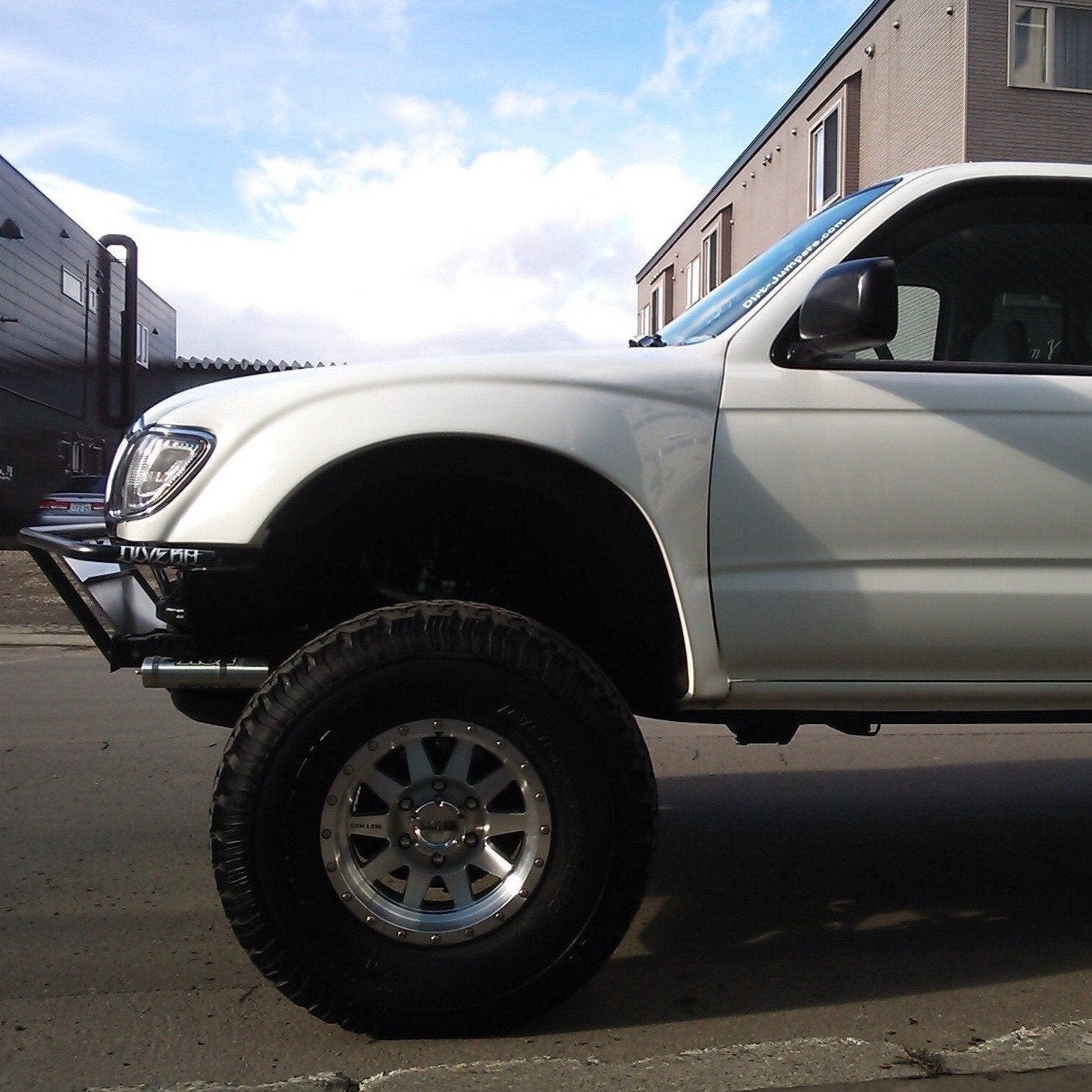 1995-2004 Toyota Tacoma fenders on a lifted truck, showcasing offroad capabilities and rugged design.