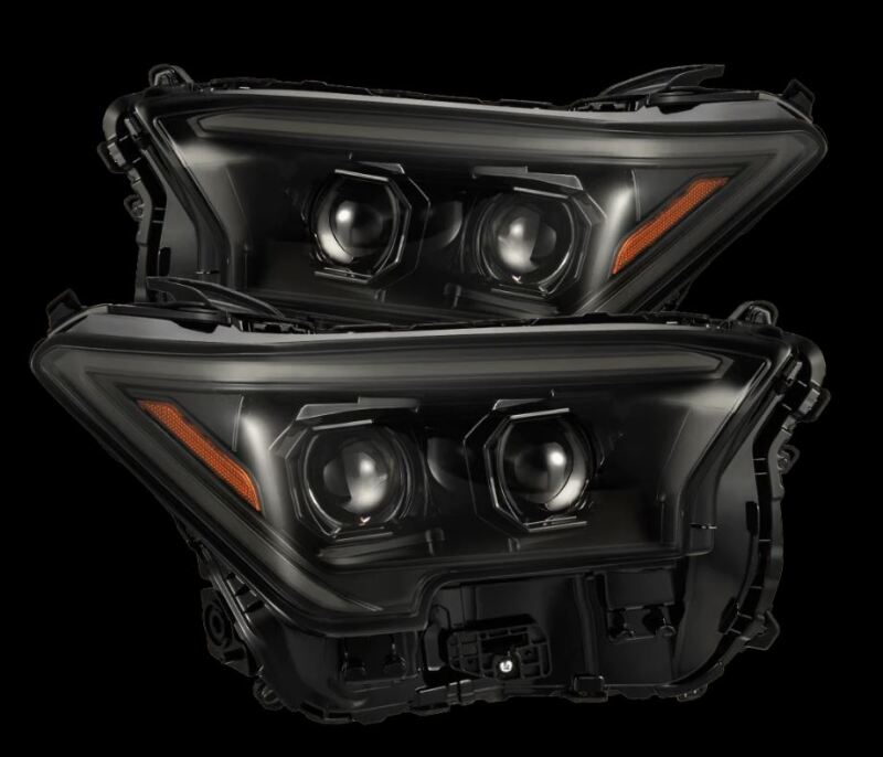 AlphaRex 2024 Toyota Tacoma LUXX-Series projector headlights featuring a sleek black design and advanced lighting technology.