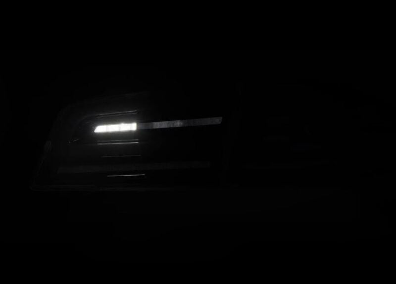 AlphaRex LUXX-Series LED tail lights for 2012-2021 Tesla Model S in Alpha-Black, showcasing a sleek, modern design.