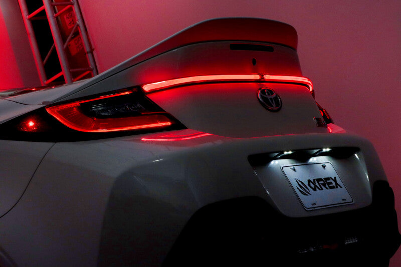 AlphaRex LUXX LED trunk center light for 22-24 Toyota GR86, featuring a smoked design and sleek red illumination.