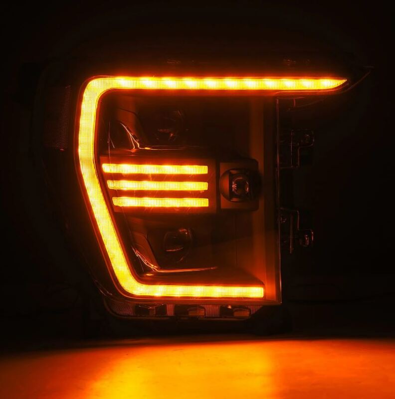 AlphaRex PRO-Series projector headlights for 21-22 Ford F150 in black with sequential signal and active light features.