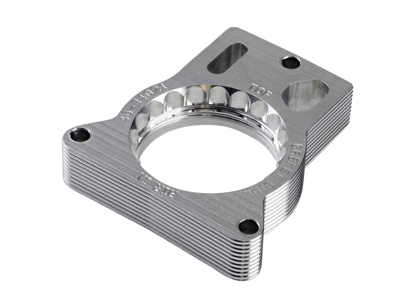 Throttle body spacer for GM Trucks 2500/3500, enhancing airflow for V8 engines 7.4L and 8.1L models from 1996 to 2007.