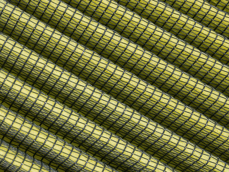 Inverted air filter with a yellow and black mesh design, designed for high-performance intake systems.