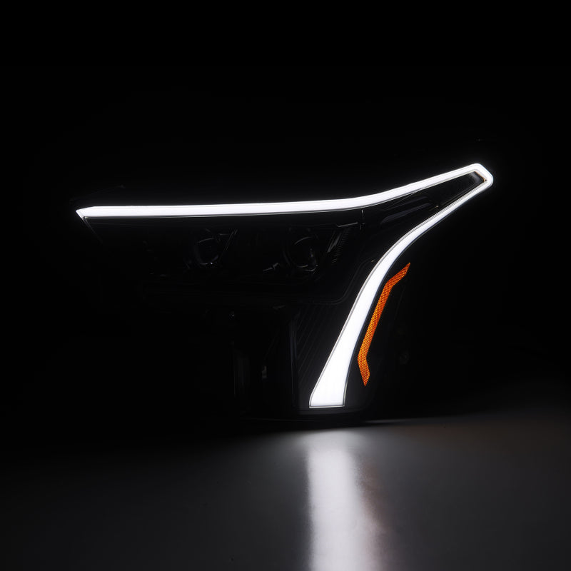 AlphaRex LUXX-Series headlights for 2022-2023 Toyota Tundra featuring a sleek black design and white DRL.