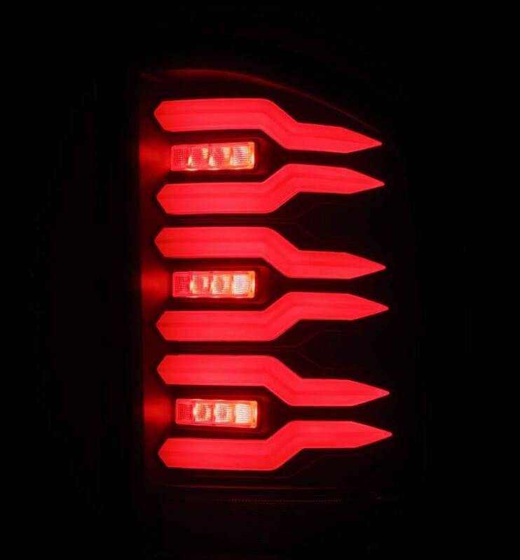 AlphaRex Luxx-Series LED tail lights for 07-14 Chevrolet Silverado with black housing and smoked lens design.