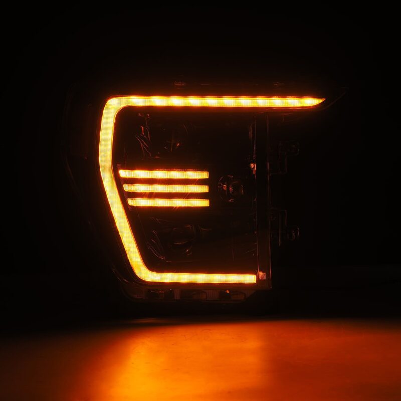 AlphaRex PRO-Series projector headlights for 21-22 Ford F150 in black with sequential signal and active light features.