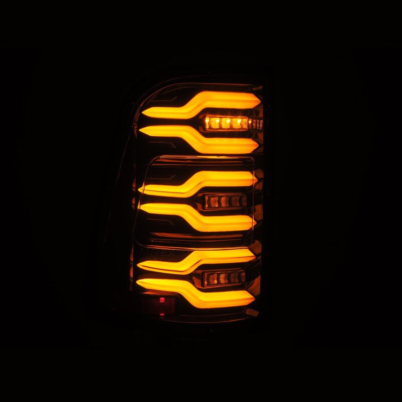 AlphaRex Luxx-Series LED tail light for 19-21 Dodge Ram 1500 in alpha-black with sequential signal and active lighting.