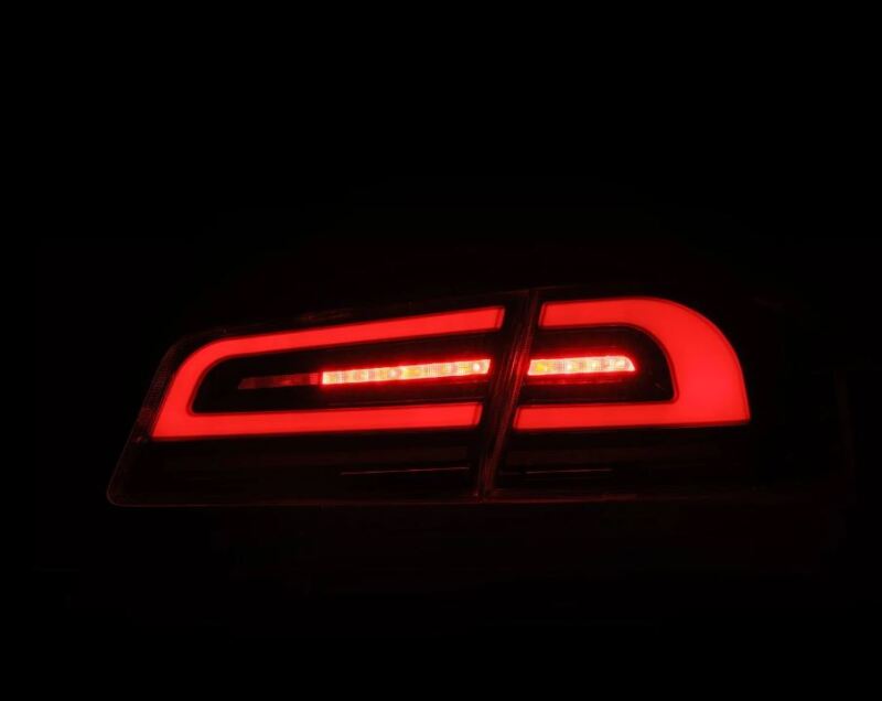 AlphaRex LUXX-Series LED tail lights for 12-21 Tesla Model S in alpha-black, showcasing a sleek red design.