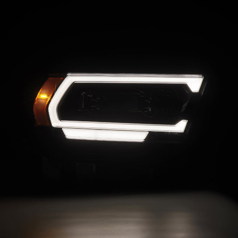 AlphaRex LUXX LED projector headlights for 2019-2022 Ram 1500 in alpha black with distinctive LED design.
