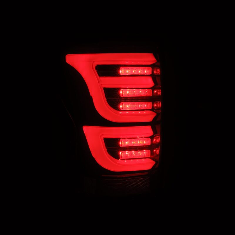 AlphaRex LUXX-Series LED tail lights for 07-13 Toyota Tundra in black and red, featuring a sleek design and bright illumination.