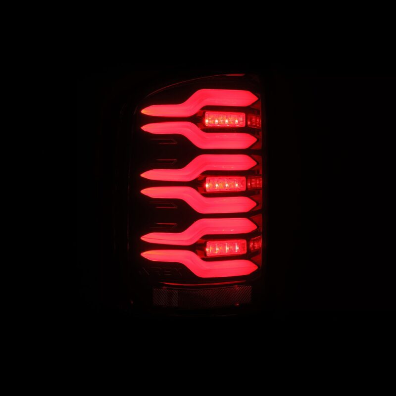 AlphaRex LUXX-Series LED tail lights for 14-18 GMC Sierra in black and red with sequential signal lighting.