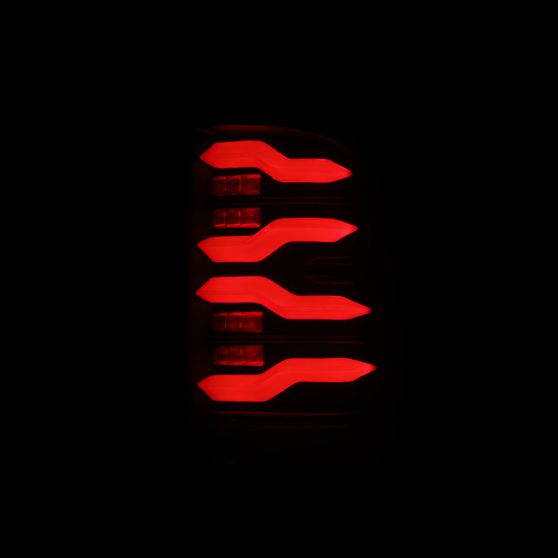 AlphaRex Luxx-Series LED tail lights for 09-18 Dodge Ram in alpha-black with sequential signal and activation light.