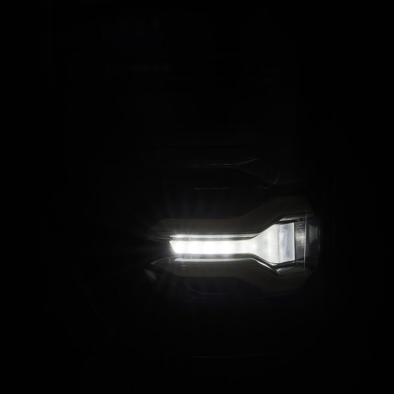 AlphaRex LUXX LED projector tail light for 21-22 Ford F150 in alpha-black, showcasing a sleek, modern design.