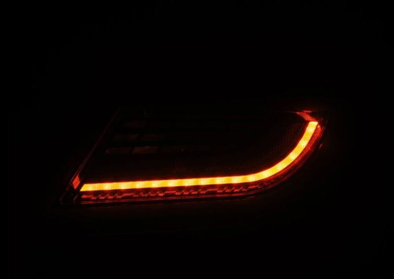 AlphaRex 22-24 Toyota GR86 LUXX LED taillight in vivid red, showcasing a sleek design and bright illumination.