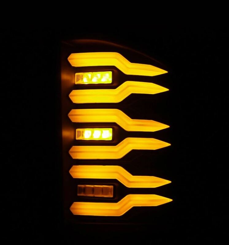 AlphaRex Luxx-Series LED tail light for 07-14 Chevrolet Silverado with black housing and smoked lens, featuring bright amber LEDs.