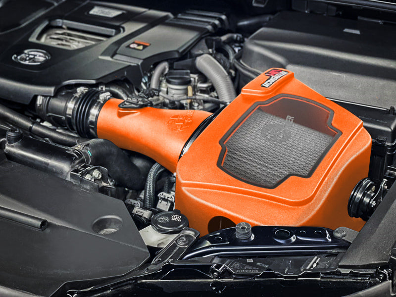 afe Momentum Sealed Intake for Toyota Land Cruiser J300 V6-3.3L, showcasing its orange housing and engine compartment installation.