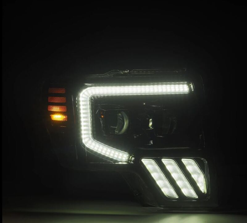 AlphaRex PRO-Series projector headlights for 09-14 Ford F-150 in black, featuring sequential signal and DRL lights.