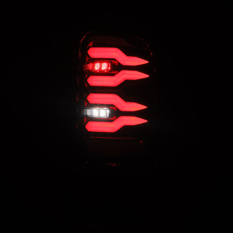 AlphaRex LUXX-Series LED tail lights for 94-01 Dodge Ram with a sleek alpha-black design and bright red illumination.