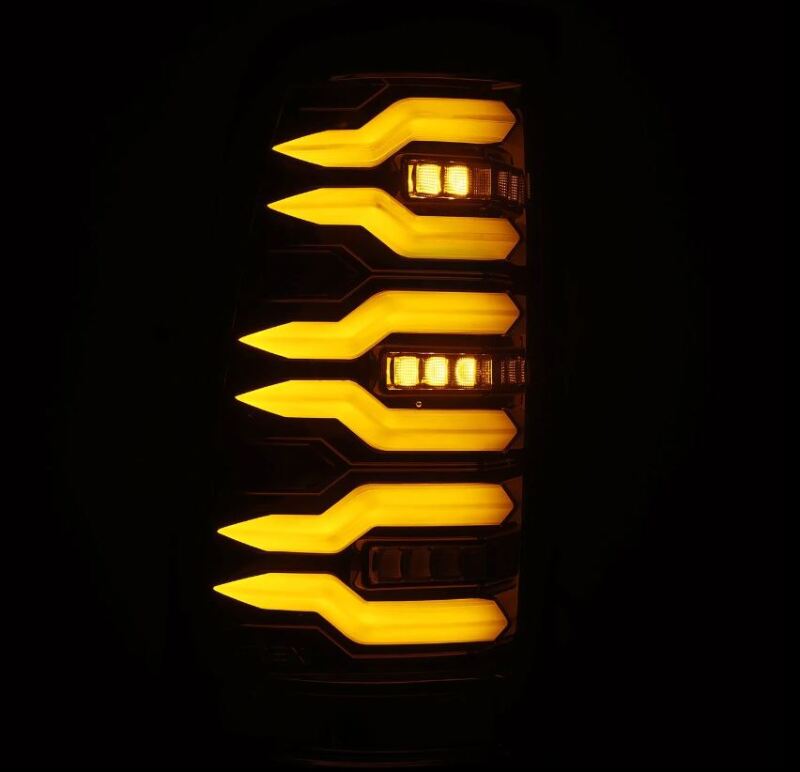 AlphaRex LUXX-Series LED tail light for 99-06 Chevrolet Silverado and GMC Sierra, featuring a sleek black design and bright amber illumination.