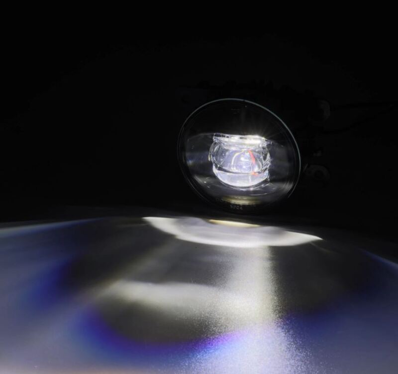 AlphaRex DoubleTap dual color LED fog light projecting bright white and amber light, designed for various vehicle models.