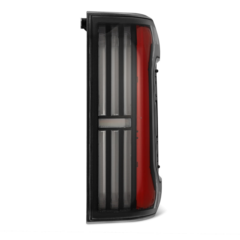 AlphaRex NOVA-Series LED prismatic tail lights for 24-25 Toyota Tacoma in black and red design.