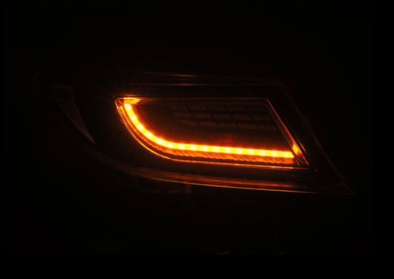 AlphaRex 22-24 Toyota GR86 LUXX LED taillight in Alpha-Black, featuring a sleek design with bright amber illumination.