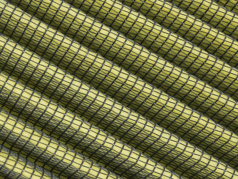 Close-up of the aFe Magnum FLOW universal air filter, showcasing its layered design and fine mesh structure for optimal airflow.
