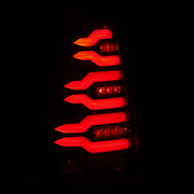 AlphaRex LUXX-Series LED tail lights for 2003-2009 Toyota 4Runner in black, featuring a modern design with bright red illumination.