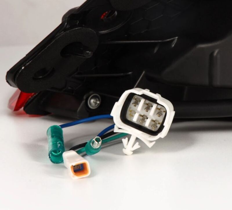 AlphaRex 22-24 Toyota GR86 LUXX LED taillights in alpha-black with wiring harness and connectors for installation.