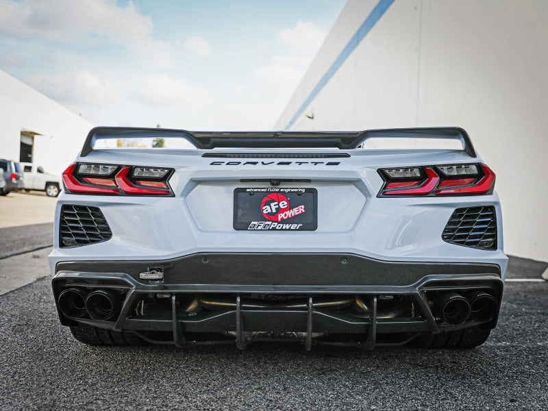 Rear view of a white Chevrolet Corvette C8 showcasing the aFe CONTROL Tow Hook, highlighting its sporty design and performance features.