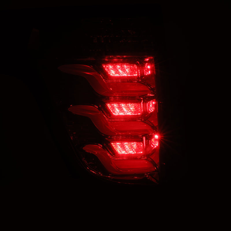 AlphaRex PRO-Series LED tail lights for 11-15 Ford Explorer in red smoke finish, showcasing bright LED illumination.