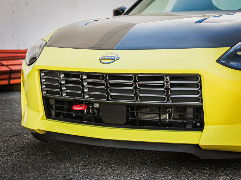 aFe CONTROL Tow Hook for Nissan Z 23-25 V6-3.0L, showcasing a sleek front grille with the tow hook prominently displayed.