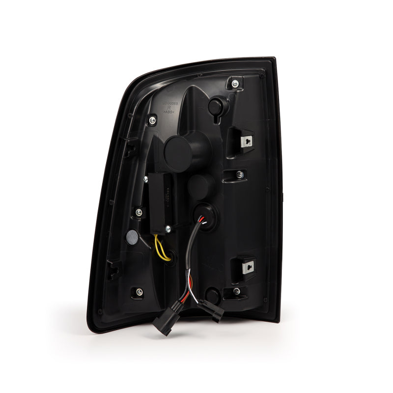AlphaRex Luxx-Series LED tail lights for 09-18 Dodge Ram featuring a sleek black design, activation light, and sequential signal.