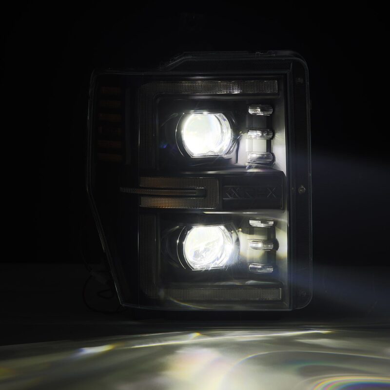 AlphaRex LUXX-Series LED projector headlights for 2008-2010 Ford F250-550, featuring black housing and sequential signals.