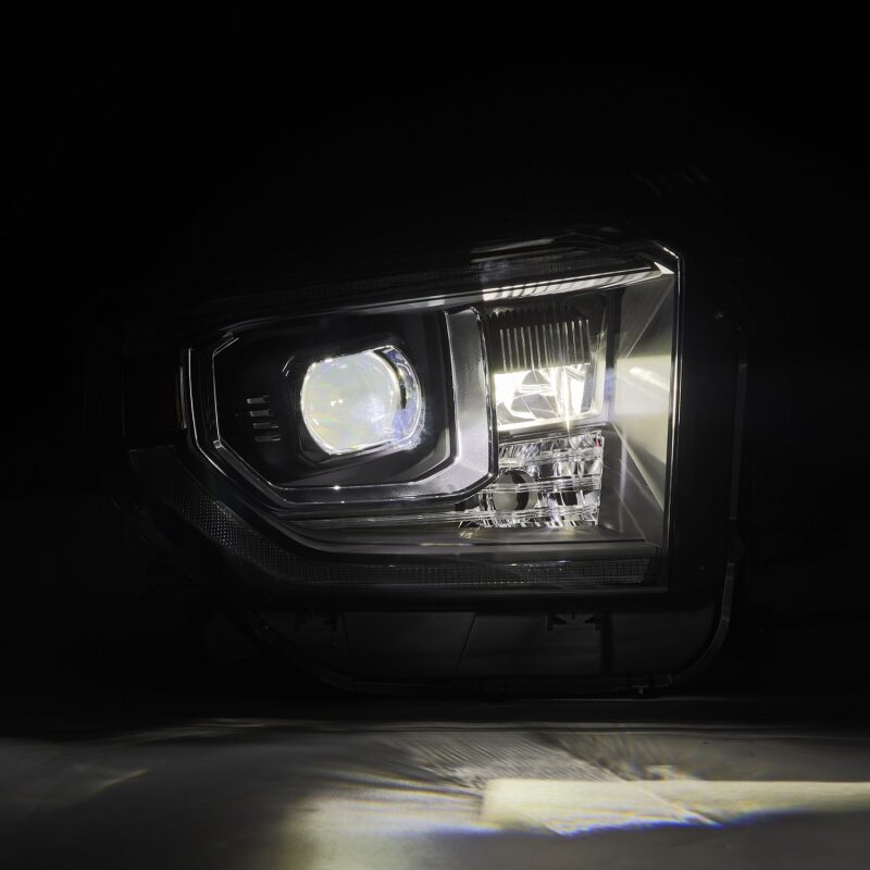 AlphaRex LUXX-Series LED projector headlights for 2014-2021 Toyota Tundra, featuring black housing, sequential signals, and DRL.