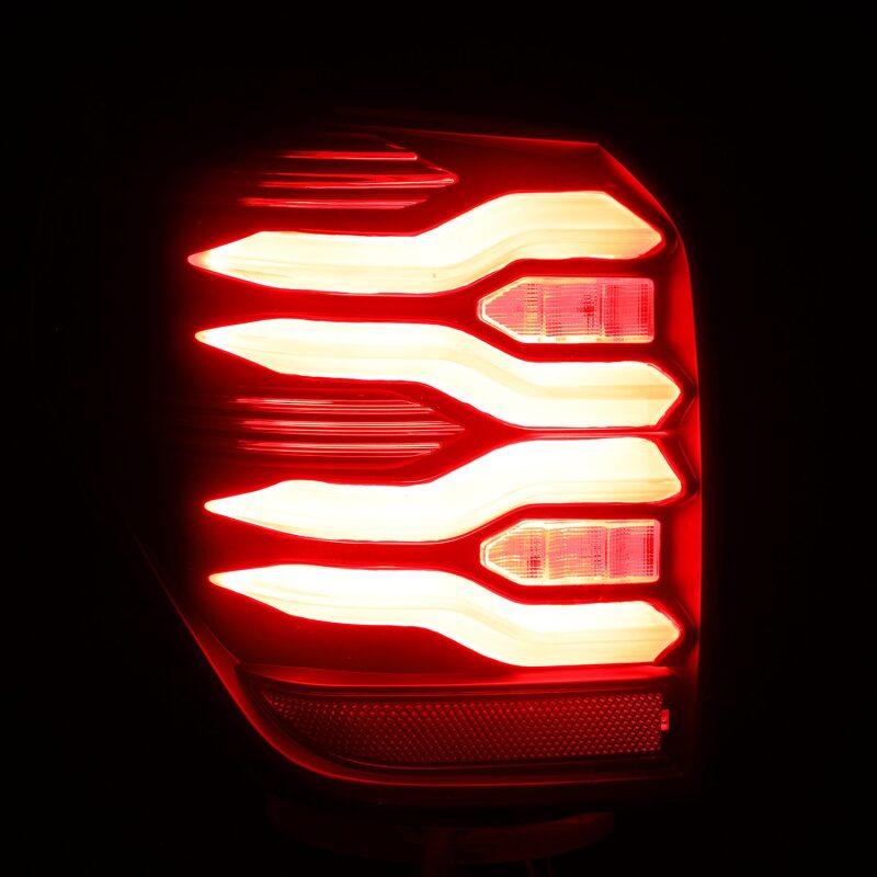 AlphaRex LUXX LED taillights for 10-21 Toyota 4Runner in black with sequential signal and activation light.