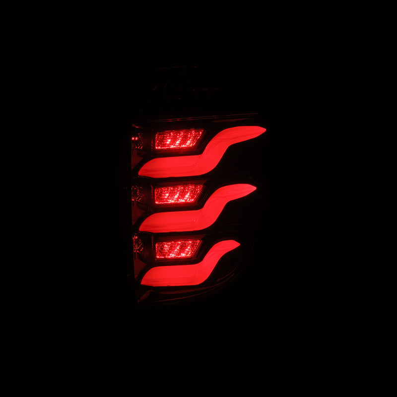 AlphaRex PRO-Series LED tail lights for 11-15 Ford Explorer in jet black, featuring a sleek design with bright red illumination.