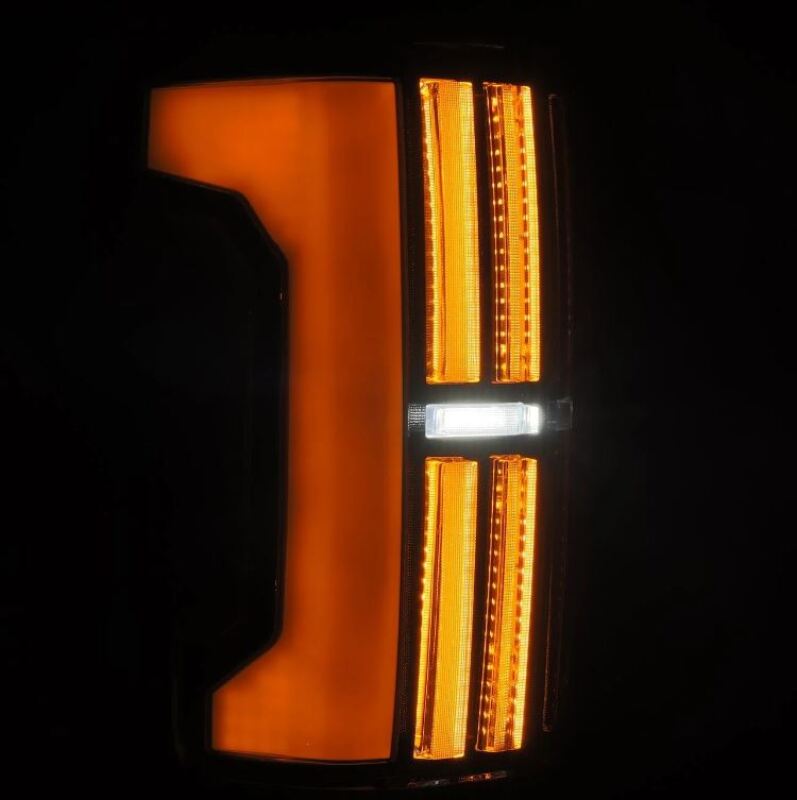 AlphaRex Nova-Series LED tail light for 07-13 Toyota Tundra in Alpha-Black, featuring a sleek design with bright amber and white LEDs.