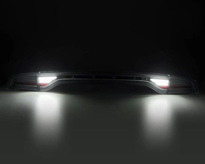 AlphaRex NOVA-Series prismatic LED tail lights for 2015-2023 Dodge Charger in chrome finish, showcasing bright illumination.