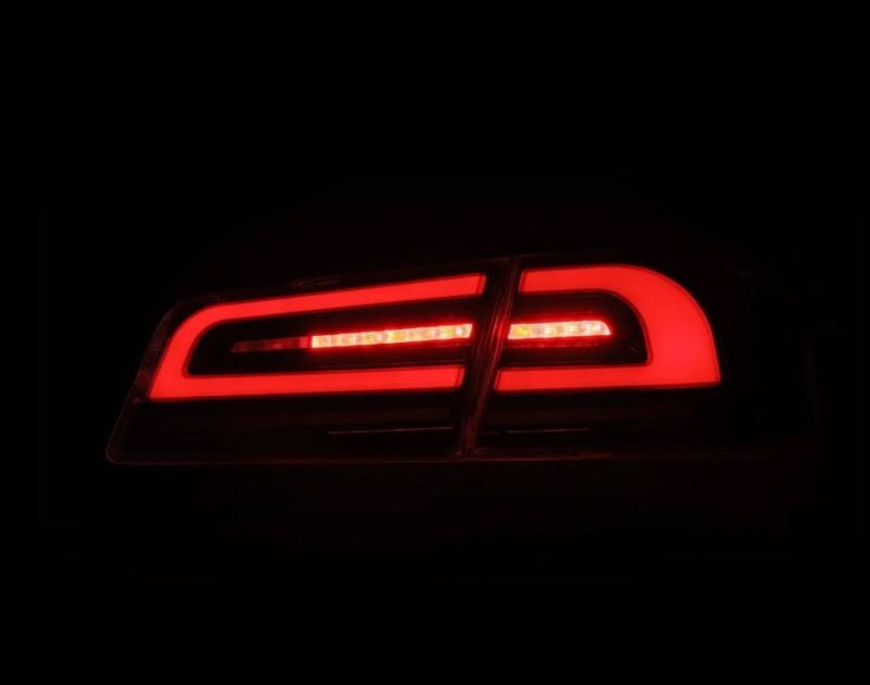 AlphaRex LUXX-Series LED tail lights for 12-21 Tesla Model S in black, featuring a sleek design and bright red illumination.