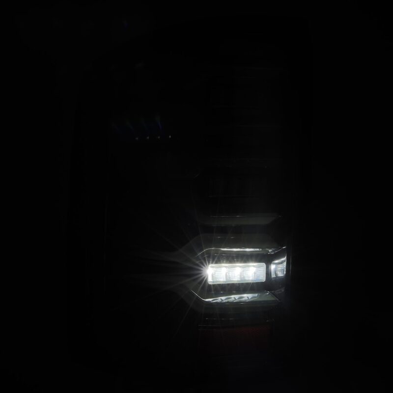 AlphaRex LUXX-Series LED tail light for 14-18 GMC Sierra 1500/2500HD/3500HD with black housing and sequential signal.