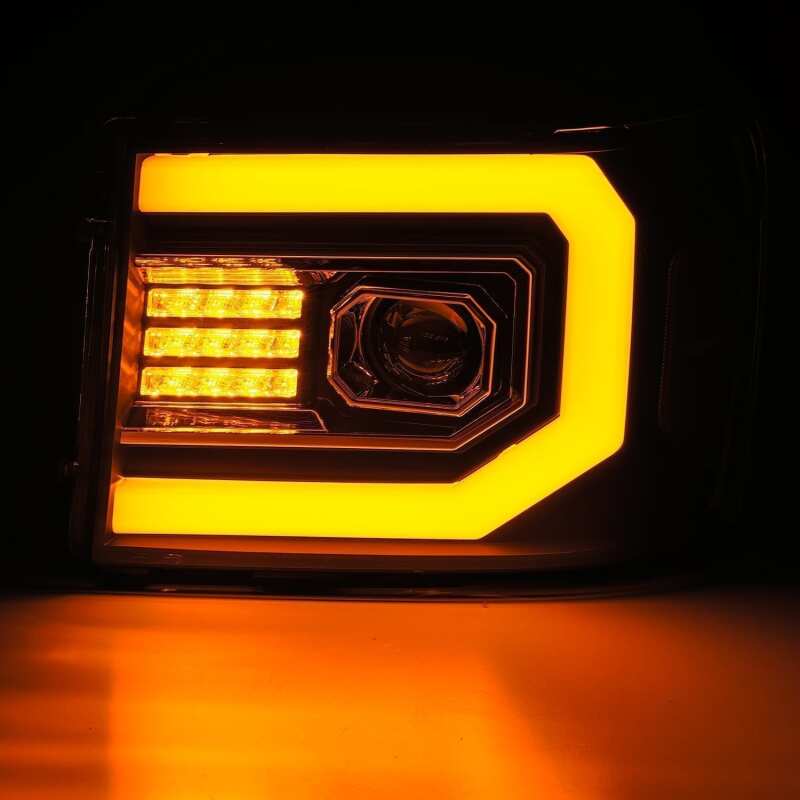 AlphaRex LUXX-Series LED projector headlight for 07-13 GMC Sierra 1500 with active lighting and sequential signal.