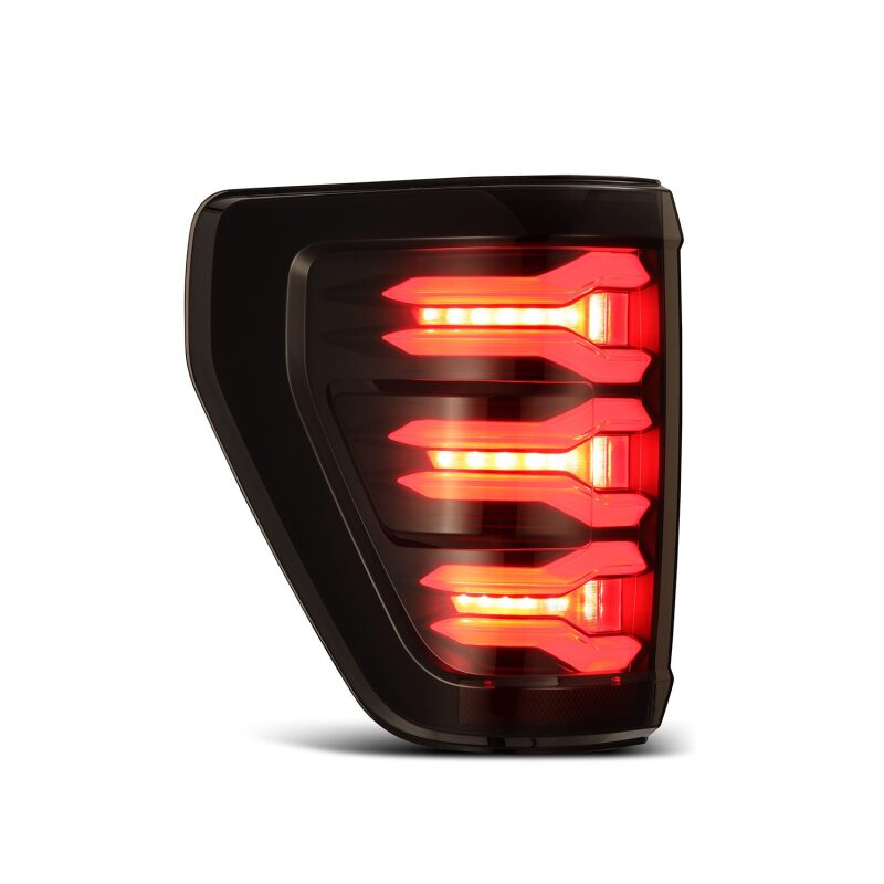 AlphaRex LUXX LED taillights for 2021-2022 Ford F-150 featuring a sleek black design and bright red LED illumination.