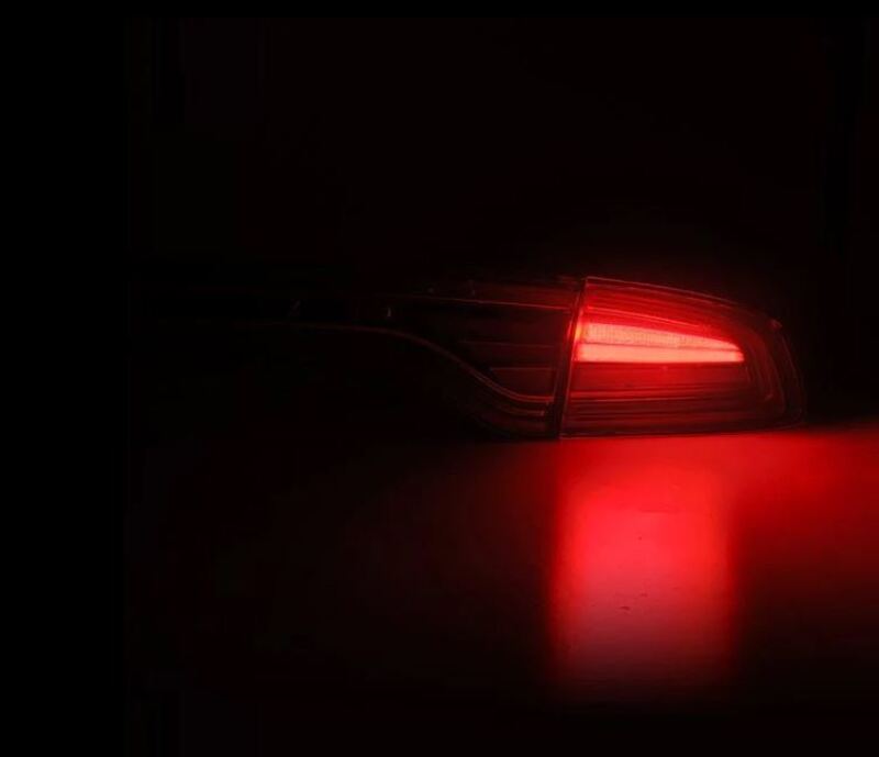 AlphaRex 15-23 Dodge Charger Nova-Series LED tail lights in Alpha-Black, featuring a sleek design and bright red illumination.